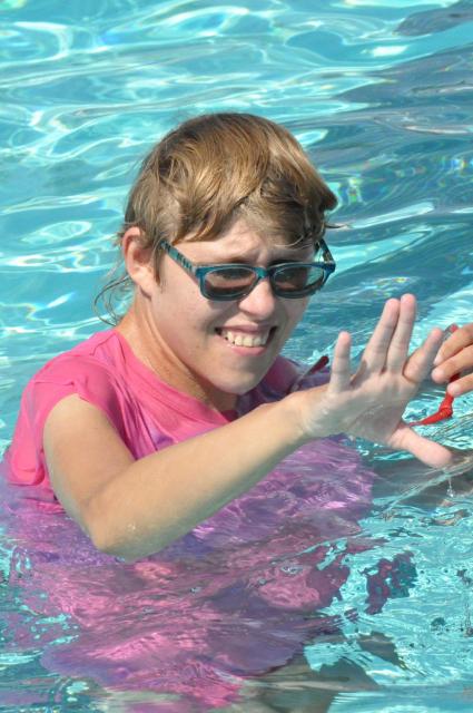 Female in the pool for splash play