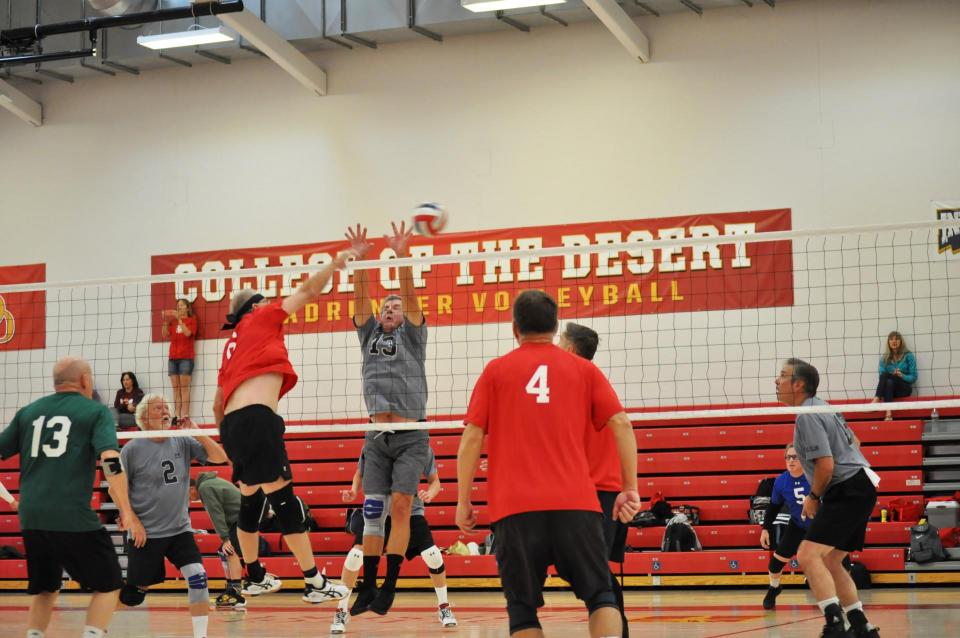 Men's Volleyball game  at the net photo